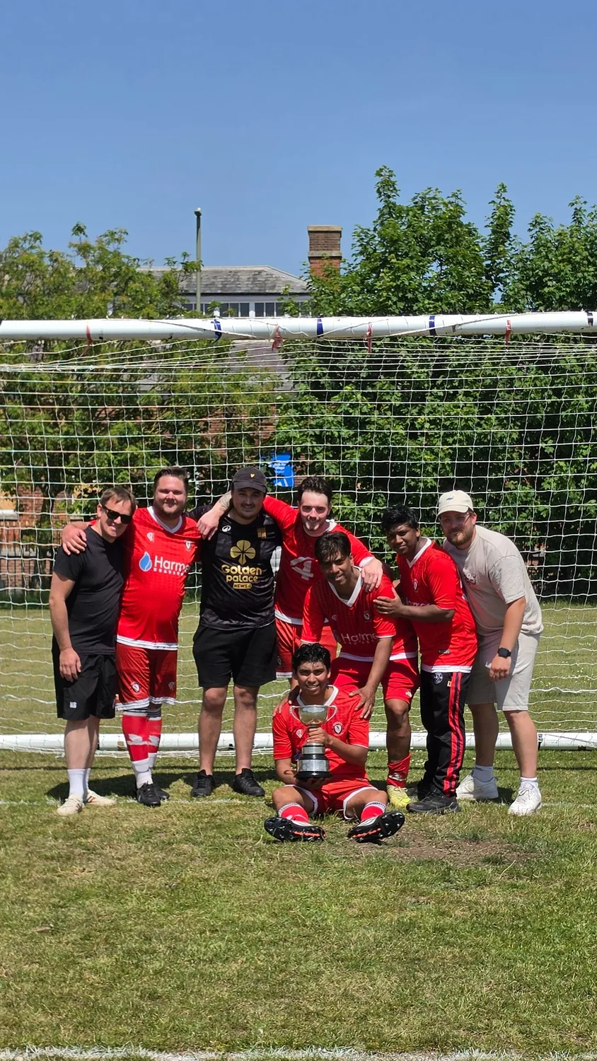 Heron United squad celebrating the title
